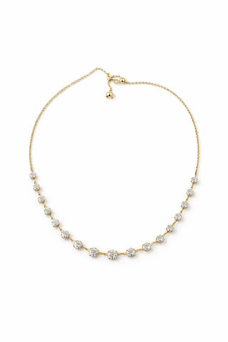 A delicate gold chain necklace featuring a row of small, round-cut clear gemstones spaced along the front, displayed on a clean white background.