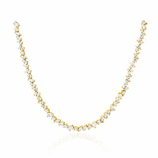 A delicate gold tennis necklace featuring marquise-cut clear gemstones in a continuous line, displayed against a clean white background with a subtle reflection below.